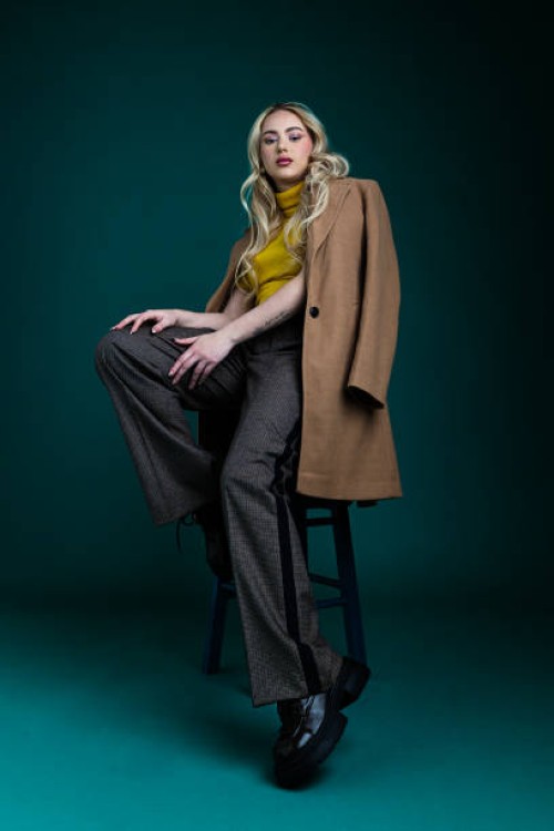 beautiful woman wearing trench coat - fashion stock pictures, royalty-free photos & images
