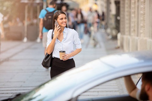 beautiful young business woman passing the street - junk food stock pictures, royalty-free photos & images