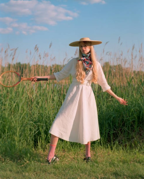 beautiful young woman near lake - fashion stock-fotos und bilder