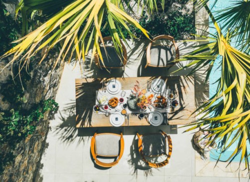 beautifully set outdoor dining table on the pool terrace. - garden decoration stock pictures, royalty-free photos & images