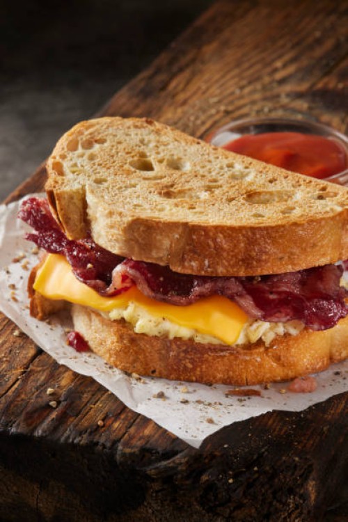 beef bacon breakfast sandwich - junk food stock pictures, royalty-free photos & images