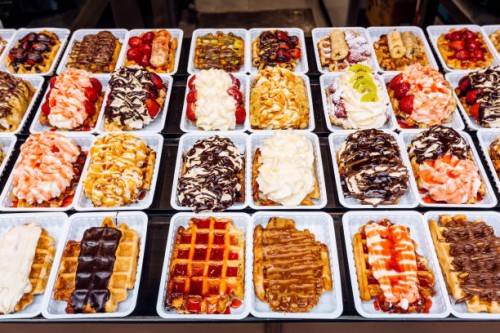 belgian waffles with various sweet toppings for sale, brussels, belgium - junk food stock pictures, royalty-free photos & images