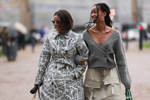 Benthe Liem seen wearing silver Celine sunnies, waist tailored Dior print coat with matching Dior Saddle bag and black Adidas Gazelle sneakers, Amaka...