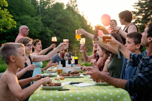 big family barbecue gathering at sunset, summer outdoors. - garden decoration stock pictures, royalty-free photos & images