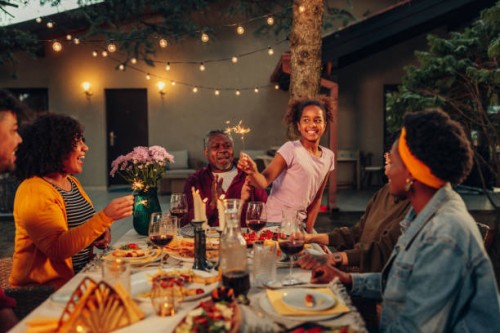 big family garden party celebration, gathered together at the dining table outdoors - garden decoration stock pictures, royalty-free photos & images