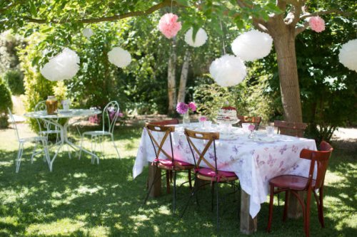 birthday table set-up in garden decorated with laterns - garden decoration stock pictures, royalty-free photos & images