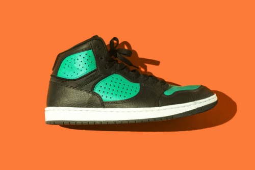 black and green basketball sneakers, on a orange background. concept for sneaker, basketball, retro, fashion, collection and casual - fashion stock pictures, royalty-free photos & images