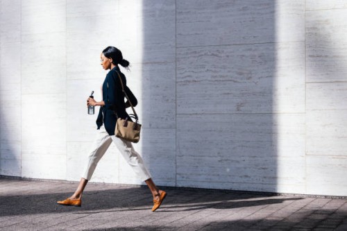 black businesswoman walking in the city with confidence - fashion stock pictures, royalty-free photos & images