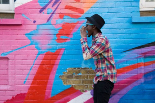 black man in sunglasses shouting near colorful wall - fashion stock pictures, royalty-free photos & images