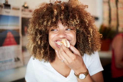 black woman biting sandwich - food stock pictures, royalty-free photos & images