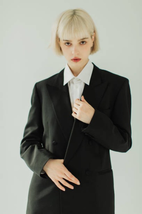 blonde woman in black suit in studio. fashion model. - fashion stock pictures, royalty-free photos & images