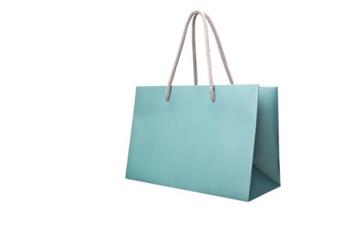 blue paper shopping bag isolated on white - fashion stock-fotos und bilder