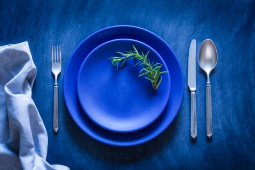 blue toned place setting shot from above on dark background - food stock pictures, royalty-free photos & images