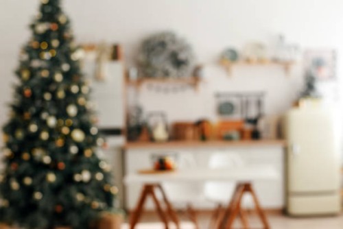 blurred defocus christmas background. blurred christmas background. christmas kitchen decor. cooking festive food in the kitchen. new year. christmas. christmas decor. christmas tree. christmas background. christmas home inte