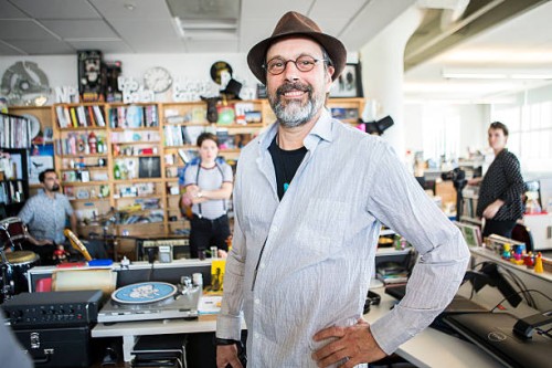 Bob Boilen, host of the Tiny Desk concert shares a laugh during sound check for artist Monika and is very timely.