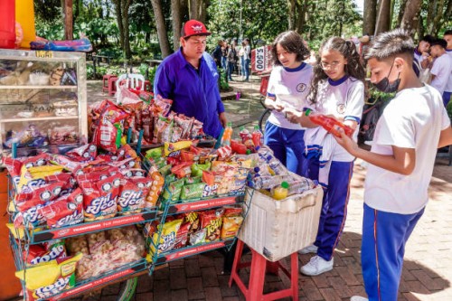 Bogota, Colombia, Jardin Botanico de Bogota, Jose Celestino Mutis Botanical Garden, snack food vendor selling to students on field trip.