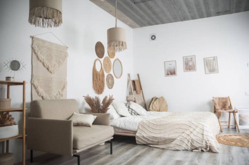 boho-chic bedroom with neutral tones and natural textures - home decoration stock pictures, royalty-free photos & images