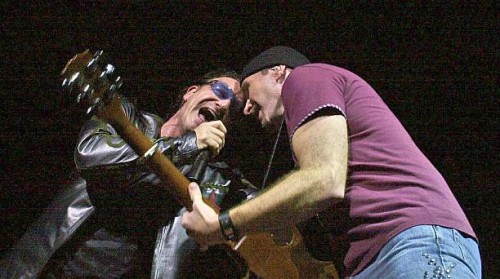 Bono and The Edge perform on stage in the U2 Concert at Earls Court on August 19, 2001 in London.