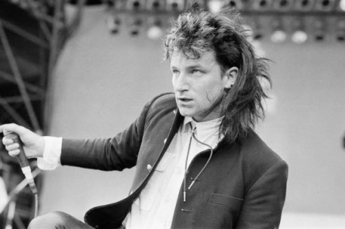 Bono performs with his band U2 at Live Aid, Wembley Stadium, London, and event to raise money to ease the famine in Ethiopia. U2 performed two songs...