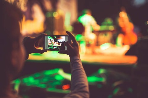 boy photographing event with mobile phone - concert stock pictures, royalty-free photos & images