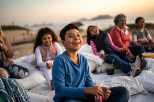 boy watching a film at the outdoors cinema - concert stock pictures, royalty-free photos & images