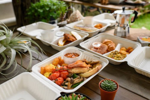 breakfast in a paper to-go box. - junk food stock pictures, royalty-free photos & images