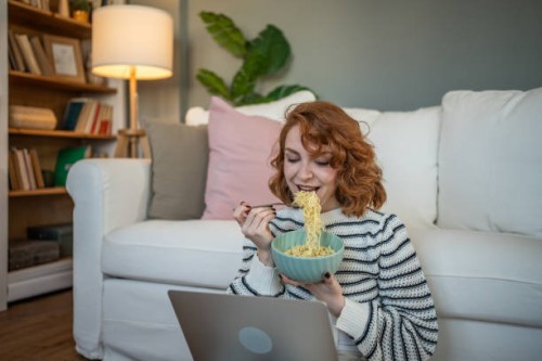 breakfast with multitasking - virtual socializing and a favorite meal - junk food stock pictures, royalty-free photos & images