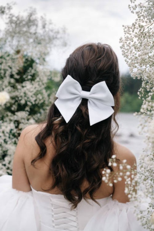 bride in a wedding dress and with a bow - hairstyle stock pictures, royalty-free photos & images