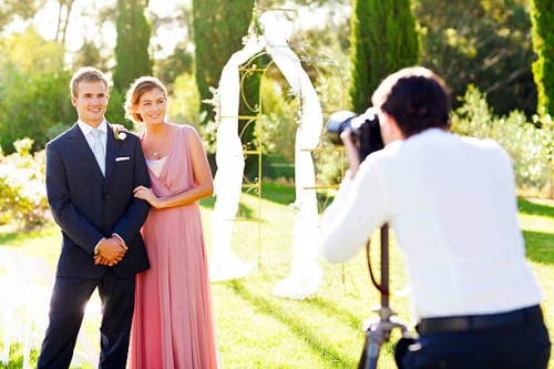 bridesmaid and best man posing for photographer - garden decoration stock pictures, royalty-free photos & images