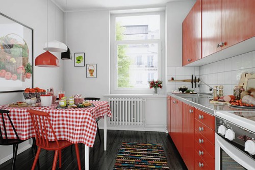 bright and charming domestic kitchen interior with red accents and classic décor - home decoration stock pictures, royalty-free photos & images
