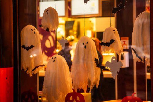 bright, spooky city store decorated for halloween. street decoration. scary ghosts window, bat, web - home decoration stock pictures, royalty-free photos & images