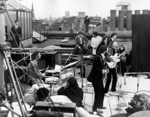 British rock group the Beatles performing their last live public concert on the rooftop of the Apple Organization building for director Michael...