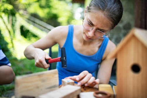 brother and sister crafting fun stuff using pieces of wood - nails art stock pictures, royalty-free photos & images