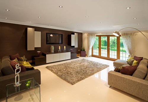 brown toned living room with a rug, couch, and television - garden decoration stock pictures, royalty-free photos & images