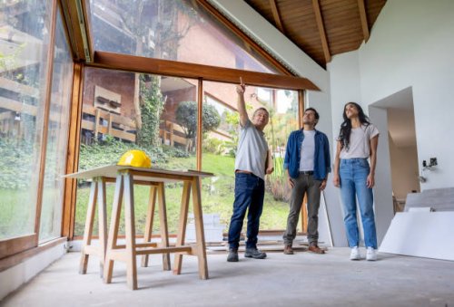 building contractor talking to clients renovating their house - home decoration stock pictures, royalty-free photos & images
