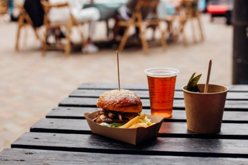 burger on a wooden table outdoor - food stock pictures, royalty-free photos & images