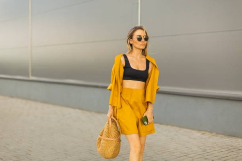 business woman with smartphone in yellow suit. lifestyle. shopping. blonde hair. bag - fashion stock pictures, royalty-free photos & images