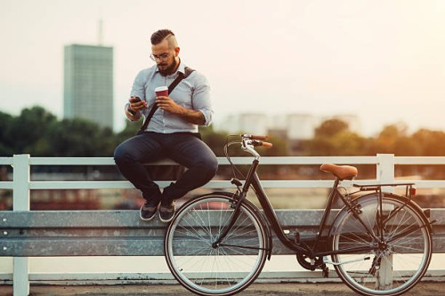 businessman using smartphone outdoors. - junk food stock pictures, royalty-free photos & images
