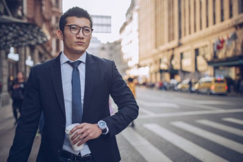 businessman with coffee cup on the street - junk food stock pictures, royalty-free photos & images