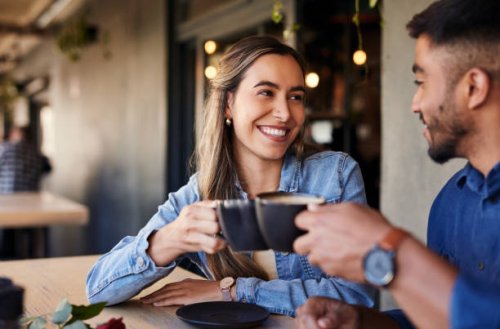 cafe, couple date cheers and woman smile in a coffee shop with a man feeling love and happiness. restaurant, discussion and happy people out for lunch talking about relationship with morning drink - coffee stock pictures, roy