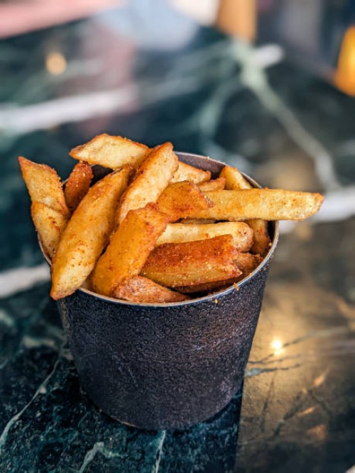 cajun seasoned french fries - junk food stock pictures, royalty-free photos & images