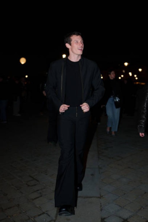 Callum Turner wears a bomber jacket , a black t-shirt, before the Louis Vuitton Menswear Fall-Winter 2025/2026 show as part of Paris Fashion Week on...