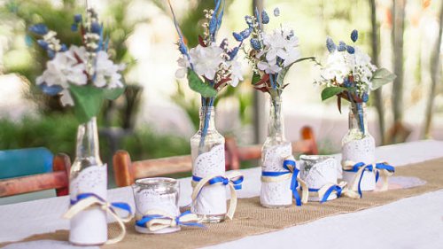 candlestick and flower arrangement on table - garden decoration stock pictures, royalty-free photos & images
