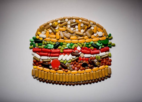 capsules and pills in shape of hamburger - food stock pictures, royalty-free photos & images