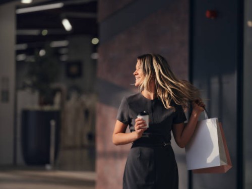 carefree businesswoman enjoying in shopping mall. - fashion stock pictures, royalty-free photos & images