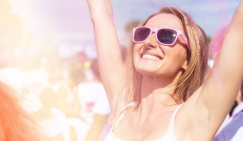 carefree woman loving the color festival - concert stock pictures, royalty-free photos & images