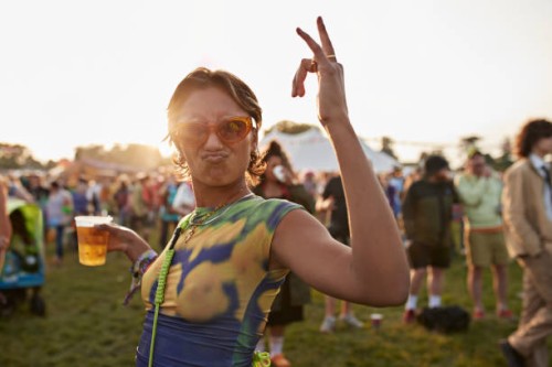 carefree young woman puckering and dancing - concert stock pictures, royalty-free photos & images