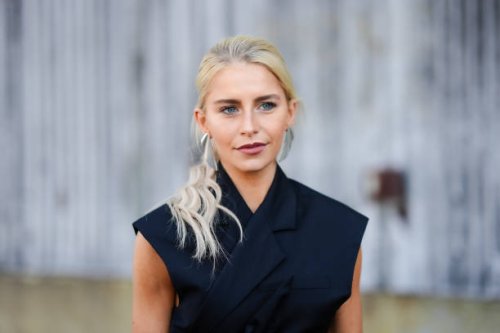 Caroline Daur wears silver earrings, a sleeveless double breasted blazer jacket , outside COS, during New York Fashion Week, on September 10, 2024 in...