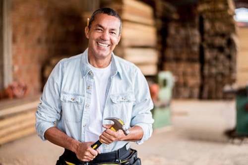 carpenter at the carpentry holding tools - home decoration stock pictures, royalty-free photos & images