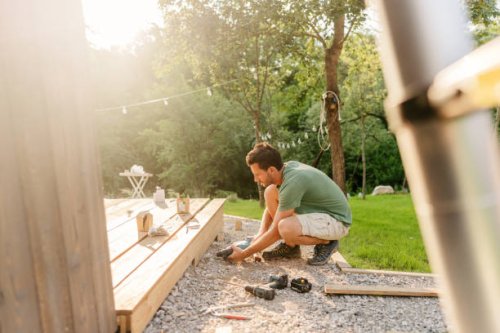 carpenter installing decking boards - home decoration stock pictures, royalty-free photos & images
